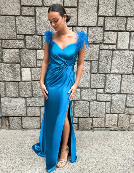 Party dress for guest with feathers on the shoulder