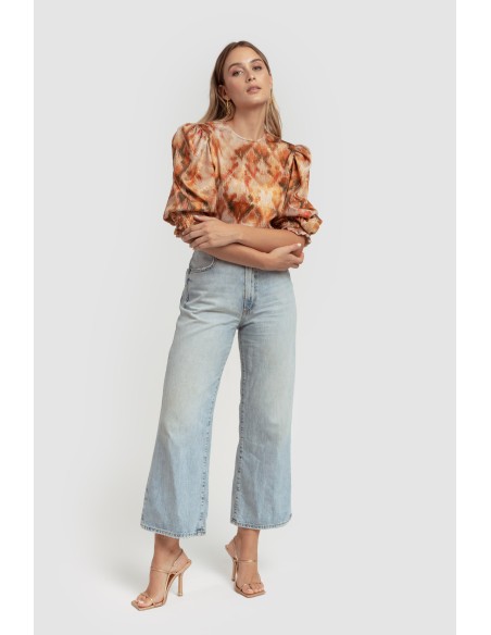 Blusa punto lúrex naranja con mangas abullonadas