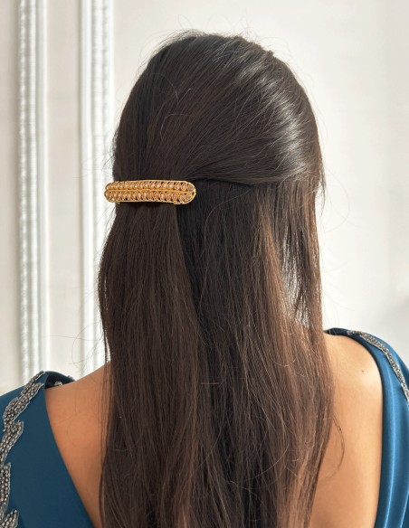Golden barrette with pink crystals in the shape of leaves