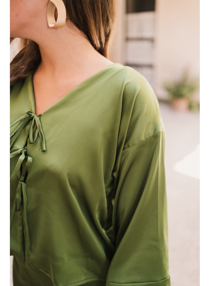 Party blouse with silky fabric and bows