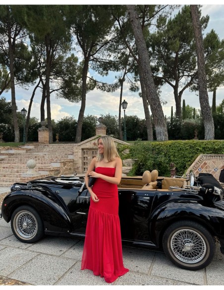 Long red strapless dress with maxi ruffle skirt