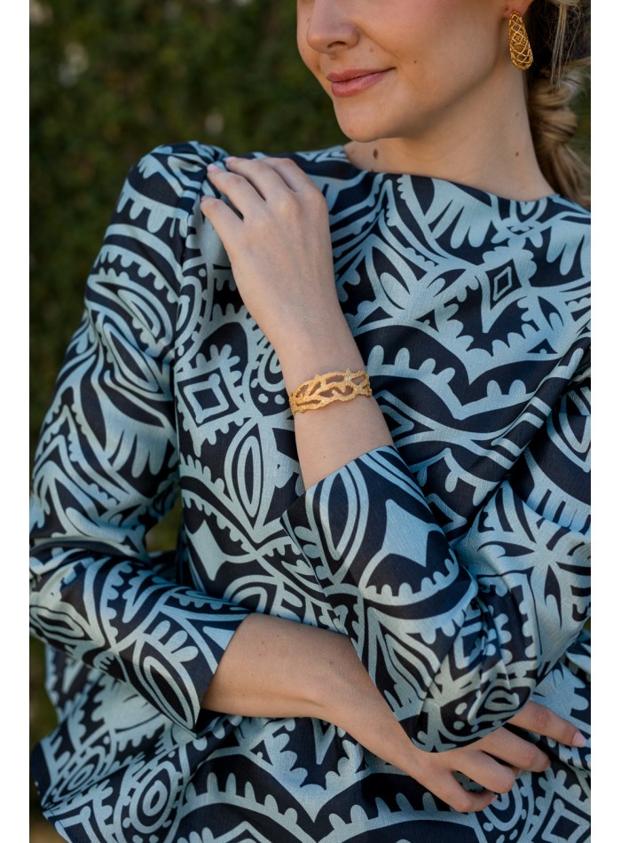 Blusa de fiesta con volante peplum estampado azul