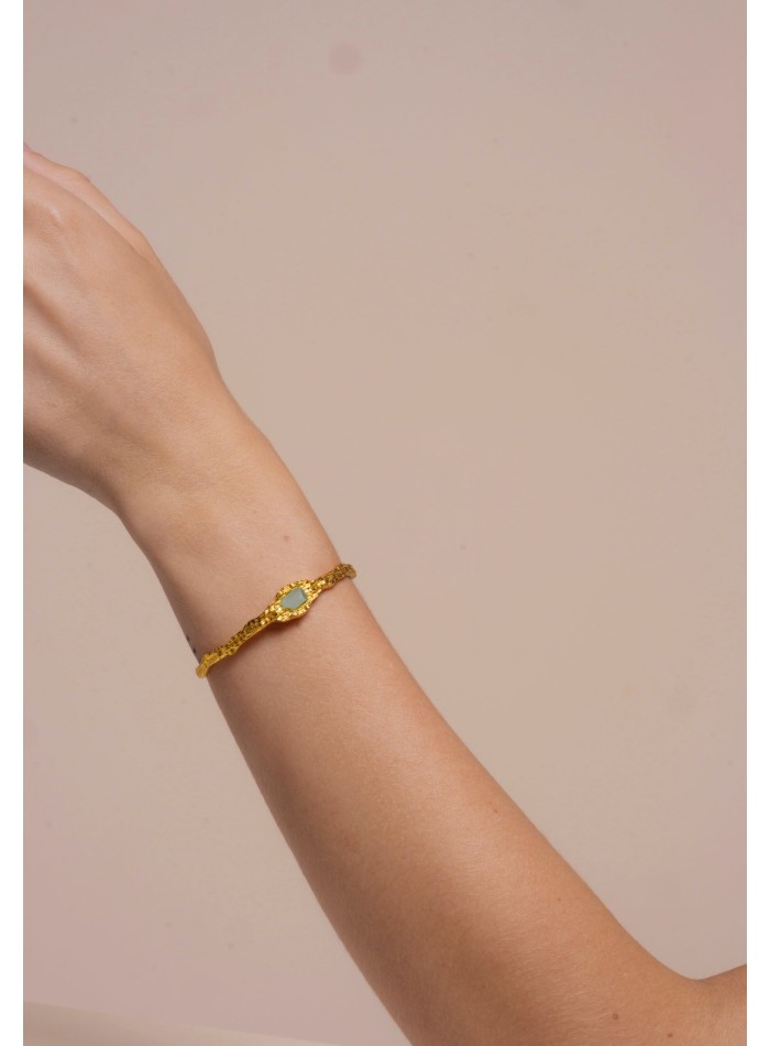 Golden bracelet with aquamarine stone