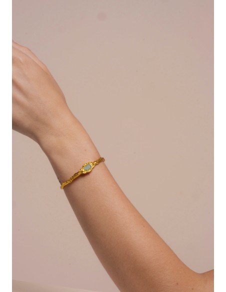 Brazalete dorado con piedra aguamarina