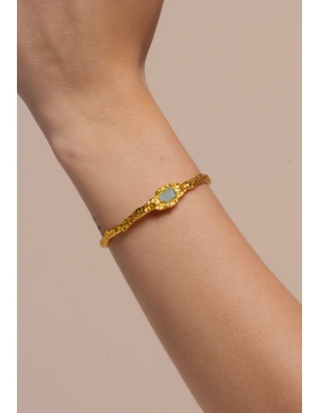 Golden bracelet with aquamarine stone
