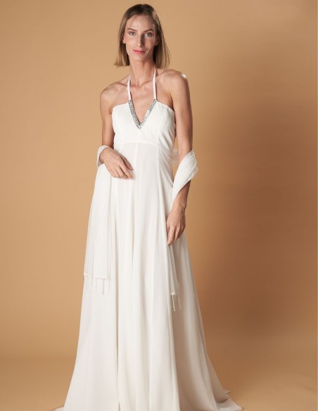 Vestido largo de novia con capa de gasa