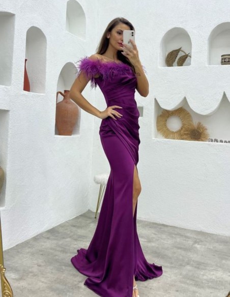 Long party dress with feathered bardot neckline and side slit
