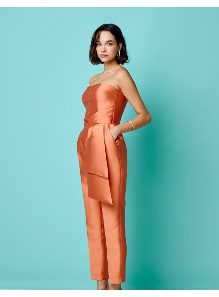 Long peach party jumpsuit with strapless neckline