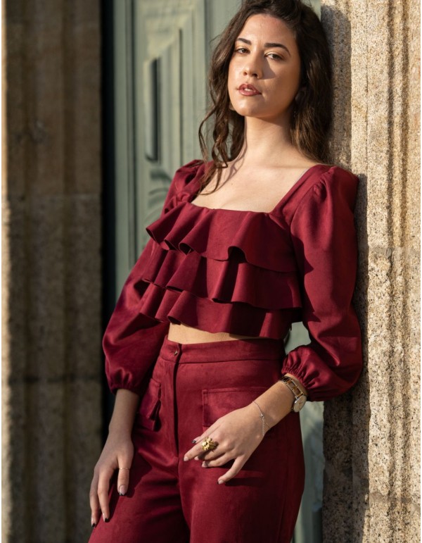 Party outfit with long pants and ruffled top