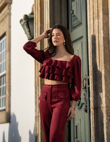 Party outfit with long pants and ruffled top