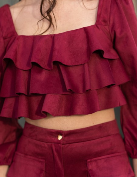 Party outfit with long pants and ruffled top