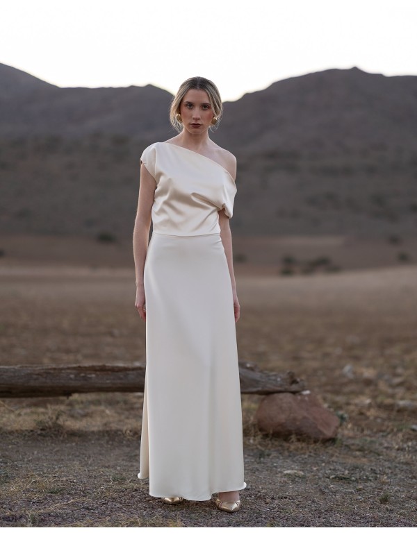 Long satin dress with cape skirt and asymmetrical bodice