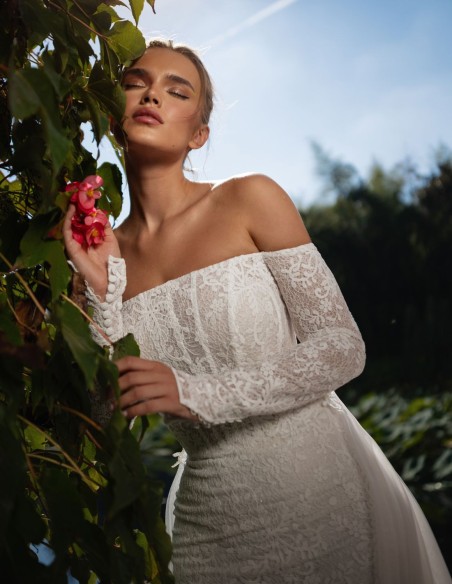 Lace wedding dress with bandeau neckline and long sleeves