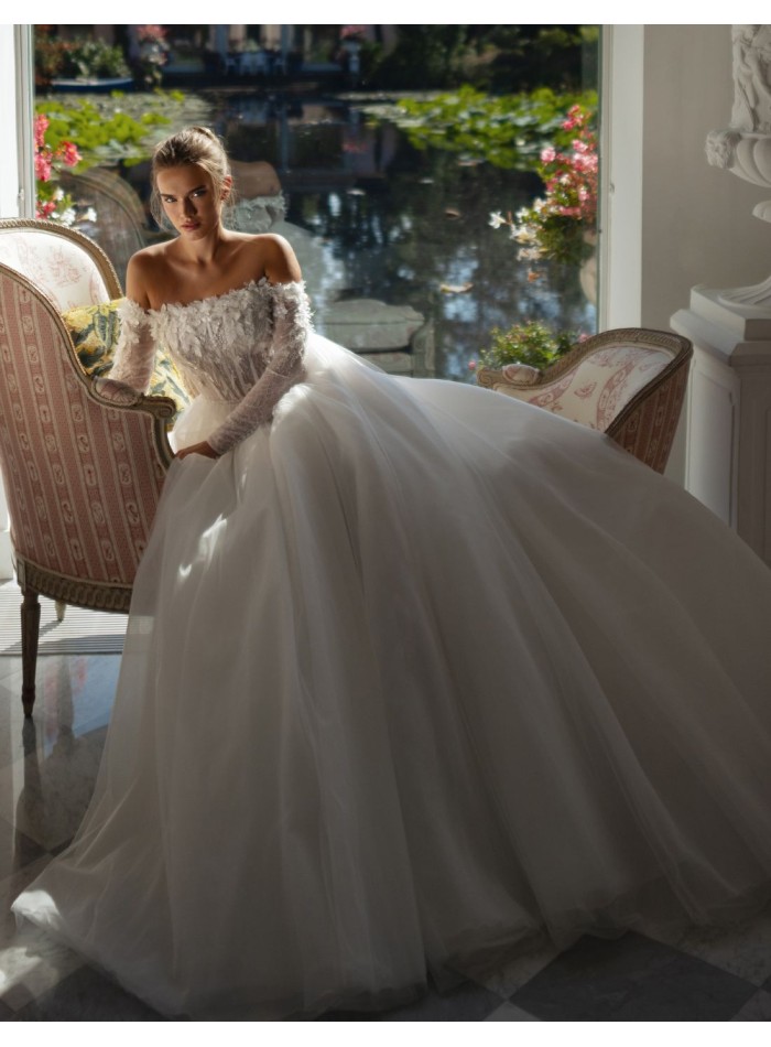 Long ivory wedding dress with lace neckline and...