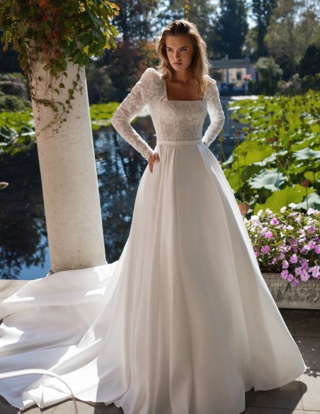 Ivory wedding dress with lace bodice and long sleeves