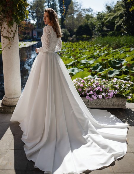 Ivory wedding dress with lace bodice and long sleeves