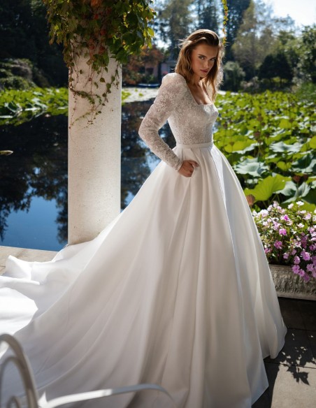 Ivory wedding dress with lace bodice and long sleeves