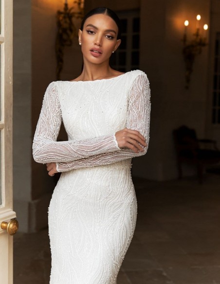 Wedding dress with long sleeves in mermaid cut with rhinestone embroidery at INVITADISIMA