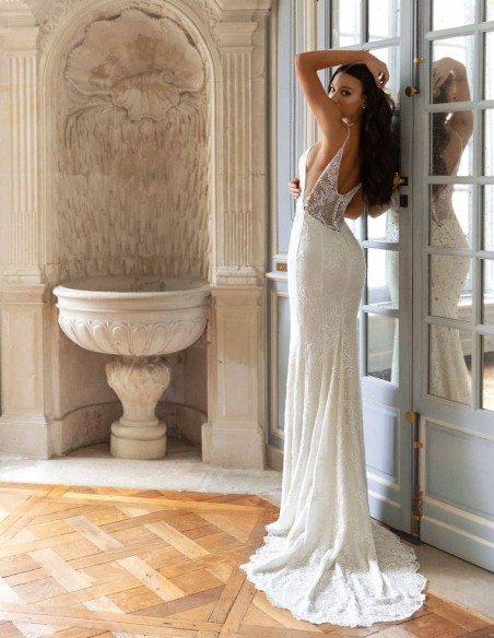 Wedding dress with a plunging V-neckline and detachable tail