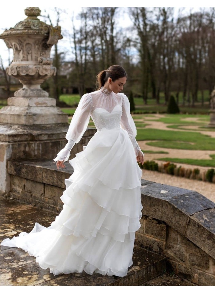 Wedding dress with long sleeves and layered skirt from Pollardi