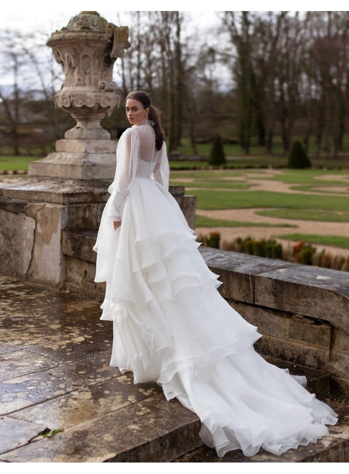 Wedding dress with long sleeves and layered skirt