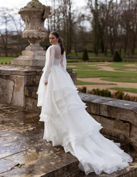 Wedding dress with long sleeves and layered skirt