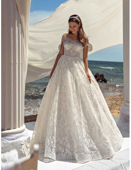 Princess cut wedding dress with wrap-around bardot neckline leaving the shoulders bare at INVITADISIMA