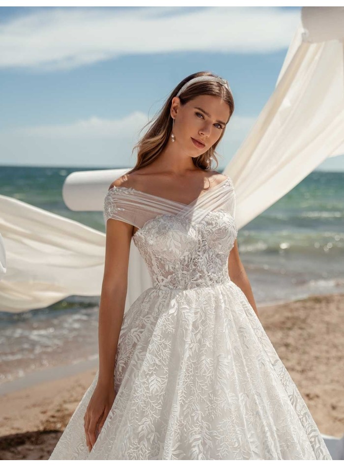 Princess cut wedding dress with wrap-around bardot neckline leaving the shoulders bare by ANNIE VICTOR