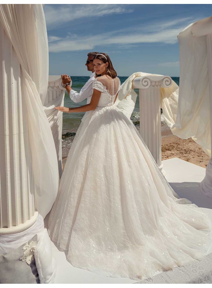 Princess cut wedding dress with boat neckline and long sleeves with transparent back at INVITADISIMA