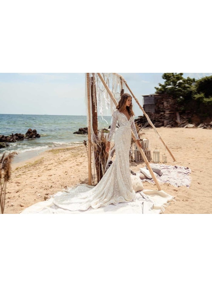 Flared wedding dress with crossover V-neckline and luxurious semitransparent lace by ANNIE VICTOR