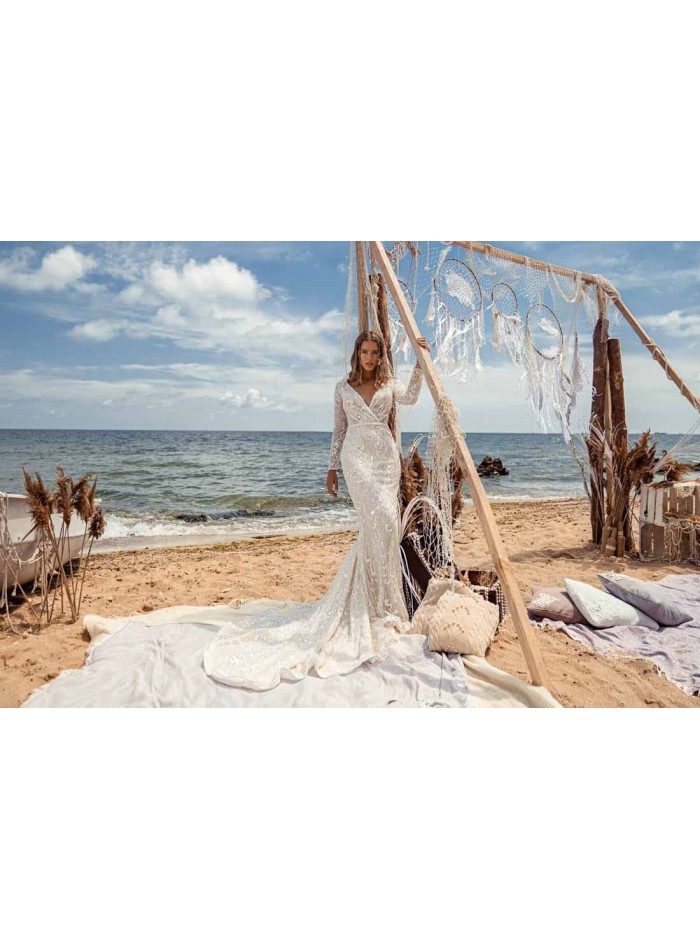 Flared wedding dress with crossover V-neckline and luxurious semitransparent lace at INVITADISIMA