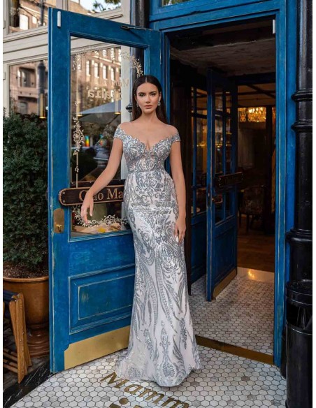 Long princess cut party dress with silver brocade and bandeau neckline.