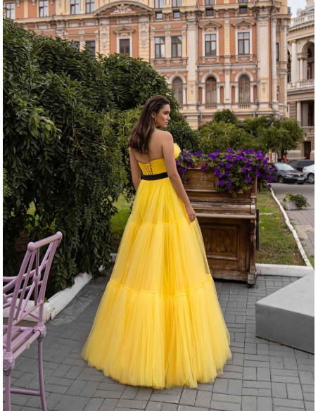 Long party dress with a strapless neckline and layers of tulle and lace by Jeorjett