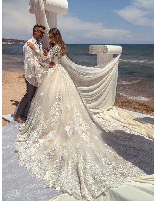 Princess wedding dress with long sleeves in tulle and guipure semi-transparent effect at INVITADISIMA