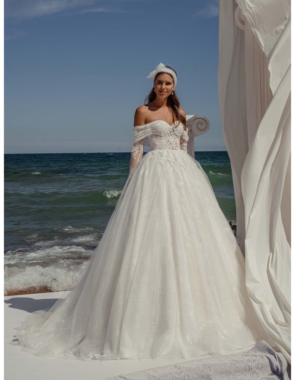Princess cut wedding dress with wrap-around neckline and long sleeves in delicate lace by ANNIE VICTOR at INVITADISIMA