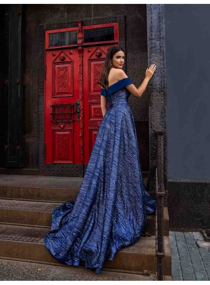 Long evening gown with a long sequined skirt and open bandeau neckline by Jeorjett