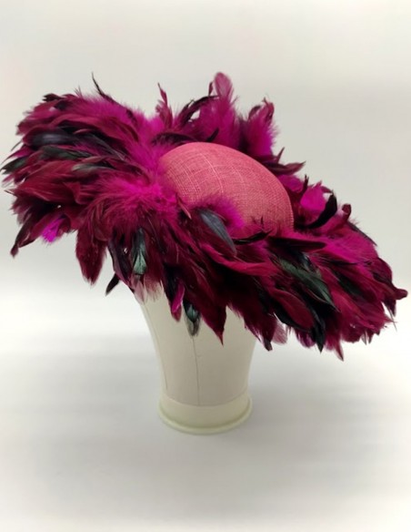 Pamela covered with pheasant feathers in bougainvillea colour