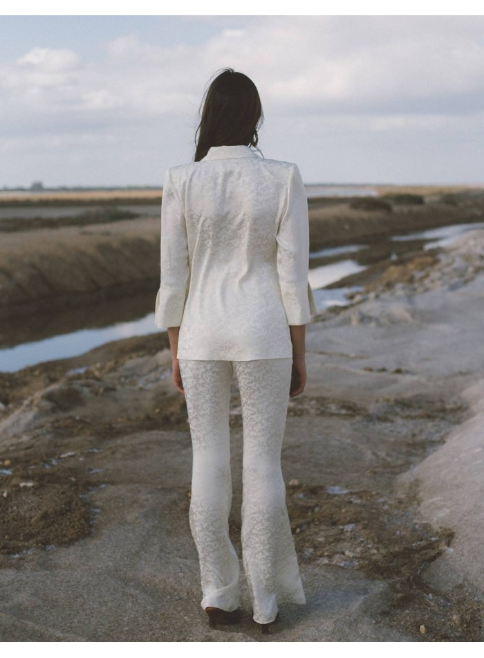 Tuxedo-style suit and bell-bottom trousers for woman