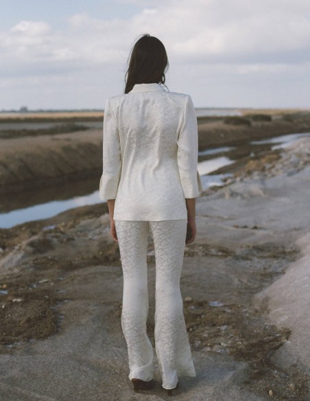 Tuxedo-style suit and bell-bottom trousers for woman