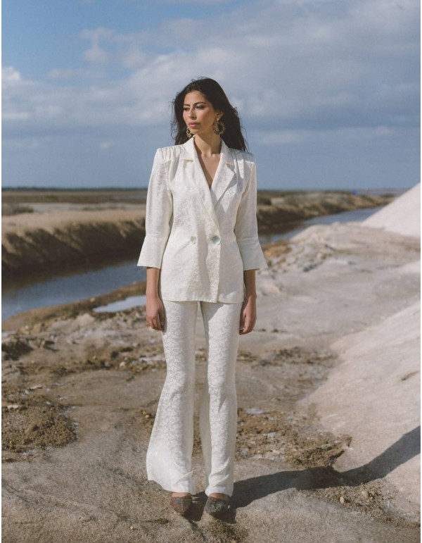 Tuxedo-style suit and bell-bottom trousers for guests