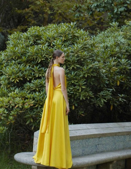 Long yellow dress with halter neckline and spaghetti straps