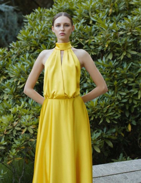 Long yellow dress with halter neckline and spaghetti straps