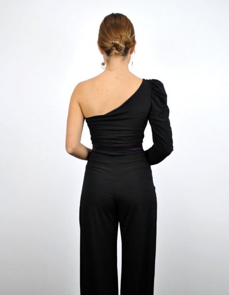 Black jumpsuit with purple waistband and asymmetrical neckline