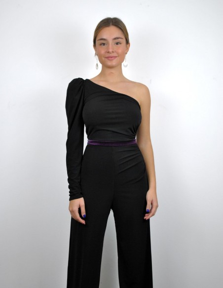 Black jumpsuit with purple waistband and asymmetrical neckline