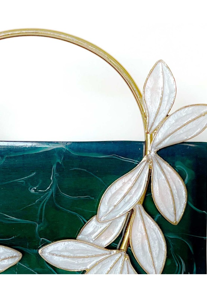 Hard pearly clutch bag in green with high...