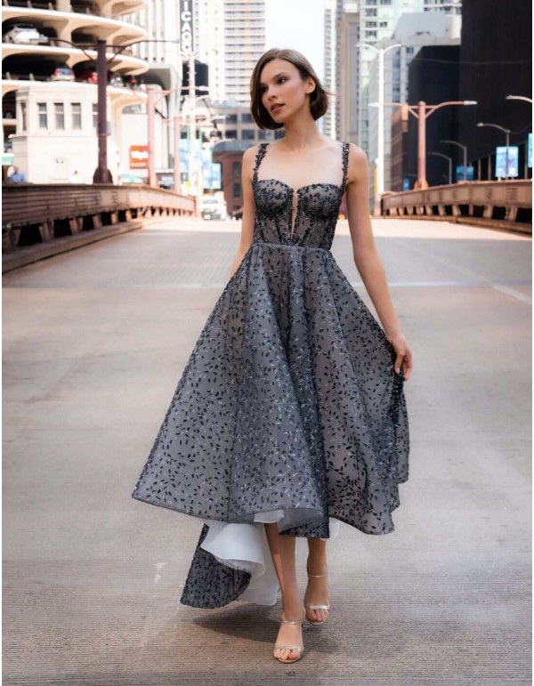 Midi party dress with corset bodice and asymmetrical skirt with shiny embroidery