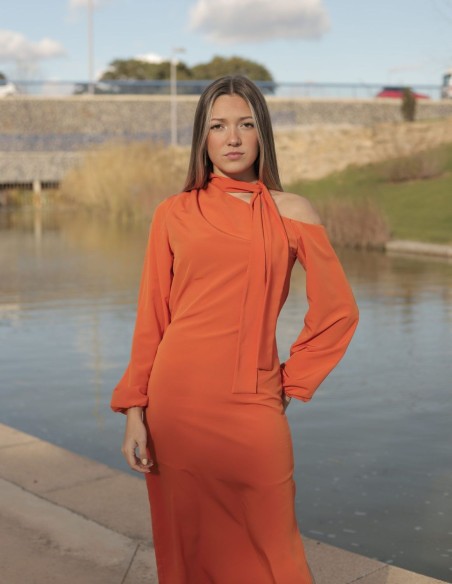 Orange cocktail dress with asymmetric neckline and long sleeves