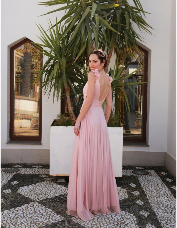 Long pleated dress with an off-the-shoulder neckline and...