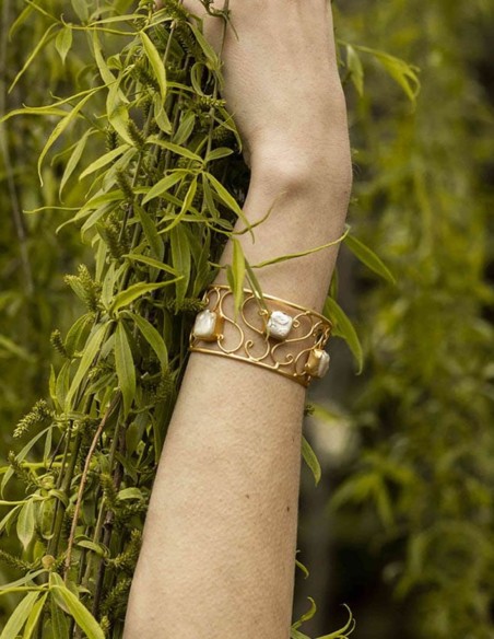 Golden bracelet with natural white stones