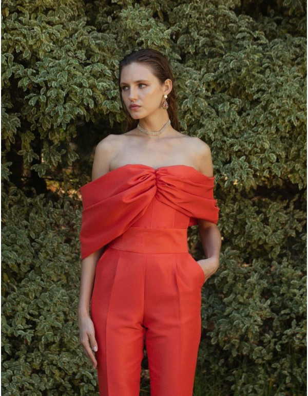 Draped crop top with strapless neckline in bright orange.